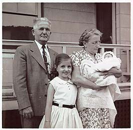 Claudette as a child with parents