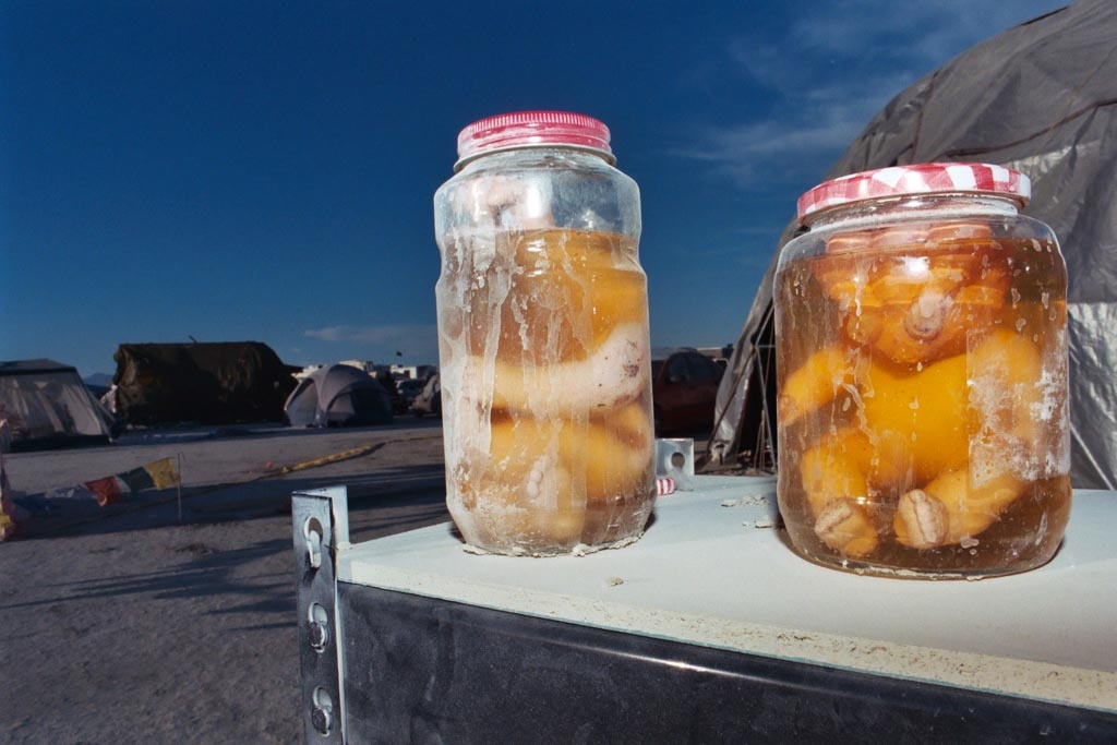 Burning Man 2003 photograph. The camp next to ours had some dolls in vinegar jars, which I thought was awesome. The guy who did the art seemed to really appreciate that I liked his art. You can see him in the people section.
