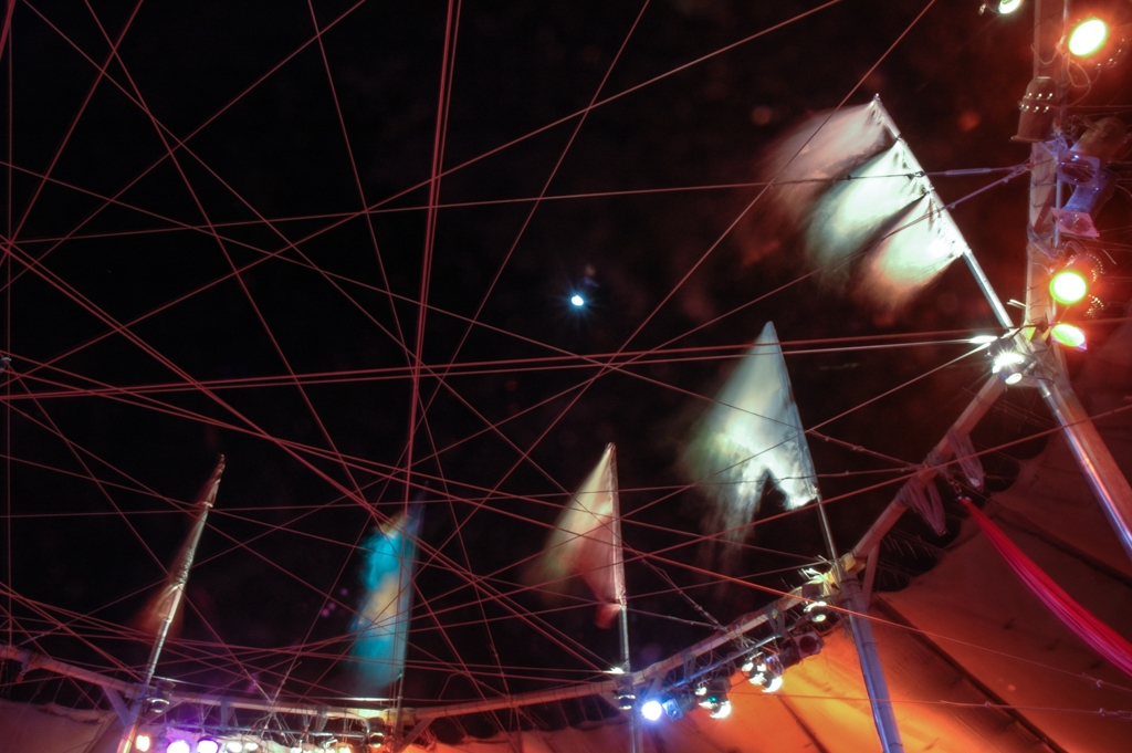 Burning Man 2004 photograph. Pretty blurred colorful flags around center camp.