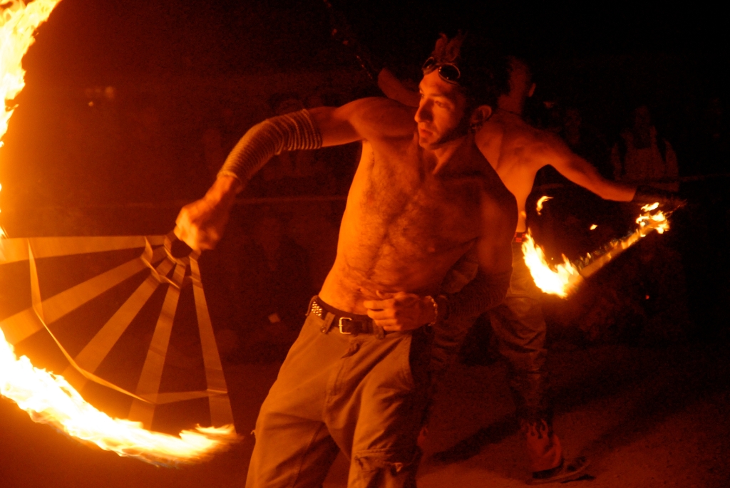 Burning Man 2006 photograph. This is Rich Risbridger, or <a href='http://www.twitter.com/dragonbutterfly/'>dragonbutterfly</a>. He was spinning at the Hookadome. See <a href='/photos/fire-and-burningman/firespinners/'>the complete firespinner photo gallery</a>.
