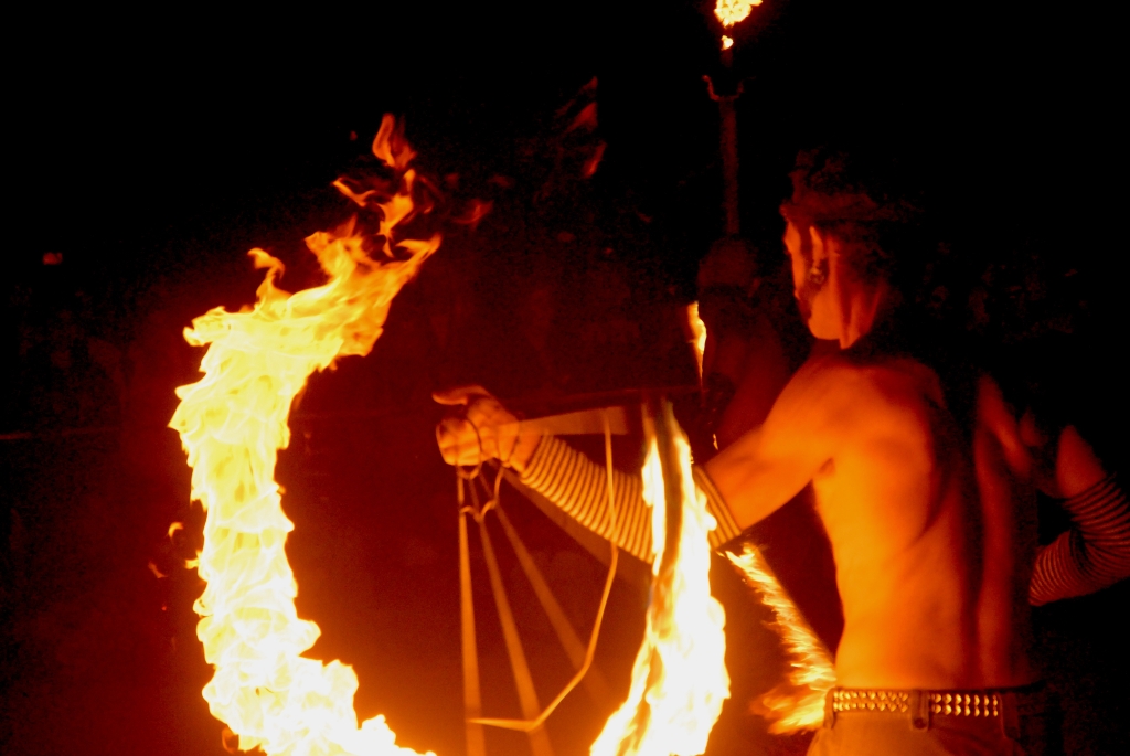 Burning Man 2006 photograph. This is Rich Risbridger, or <a href='http://www.twitter.com/dragonbutterfly/'>dragonbutterfly</a>. He was spinning at the Hookadome. See <a href='/photos/fire-and-burningman/firespinners/'>the complete firespinner gallery</a> for more photos of fire spinners.