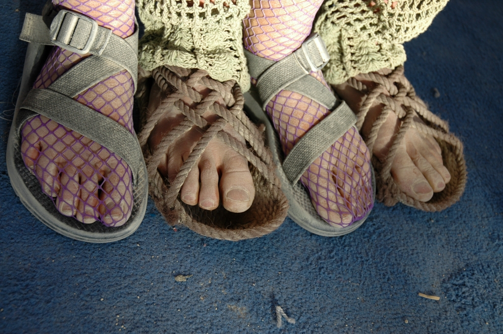 Feet and Shoes photograph. I like how some people choose to interlace their feet.