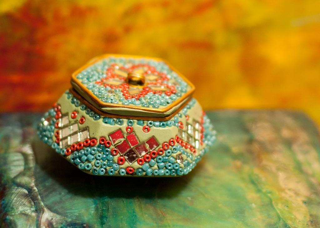 Colorful things photograph. I perched this box on two of my acrylic paintings (one blue, one orange).