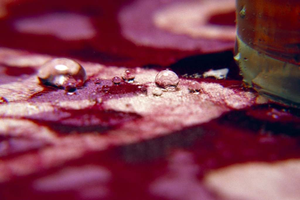 Colorful things photograph. Water, next to apple juice.