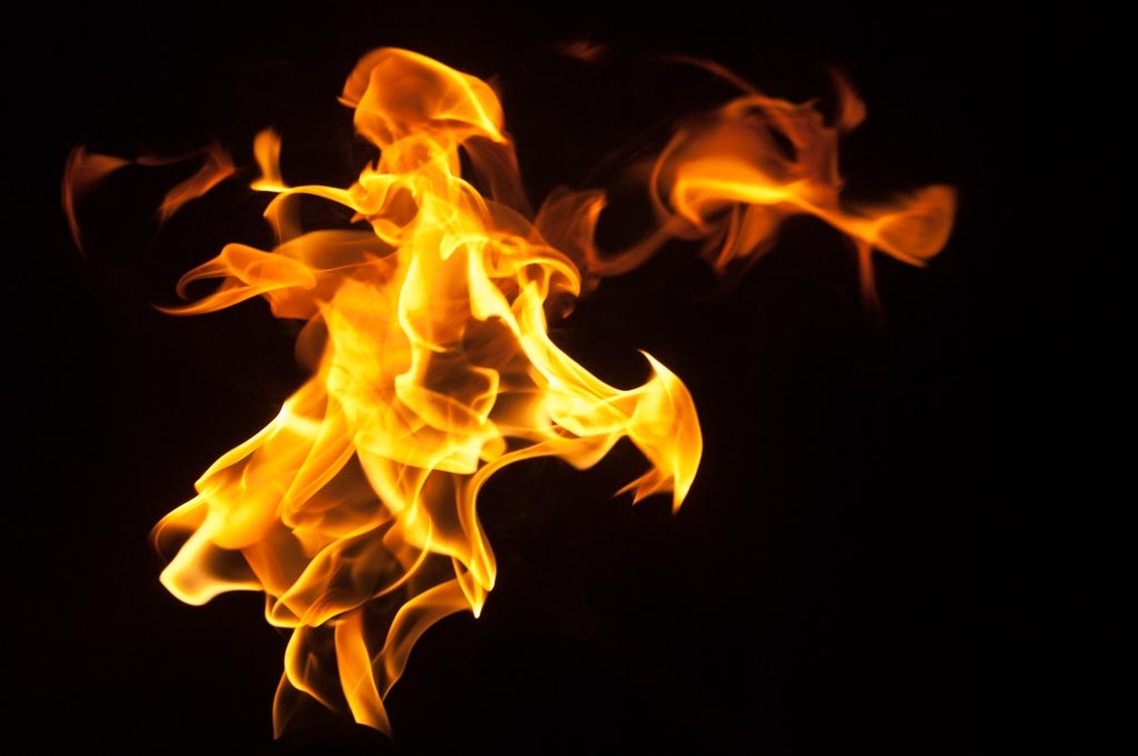 Fire and flames on a black background photograph. 