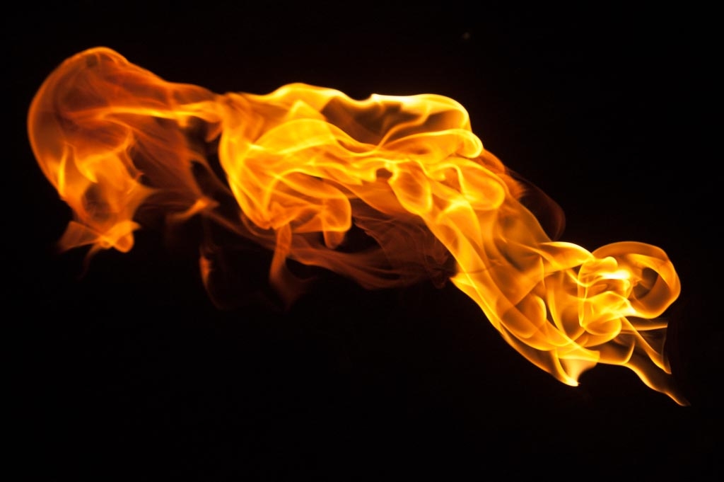Fire and flames on a black background photograph. 