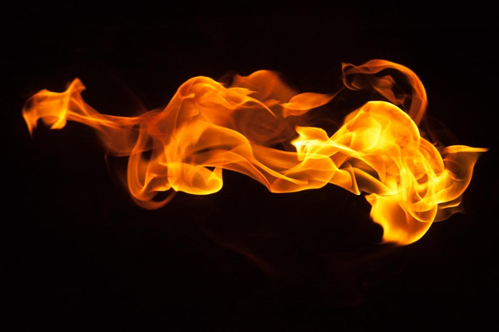 Fire and flames on a black background photograph. 