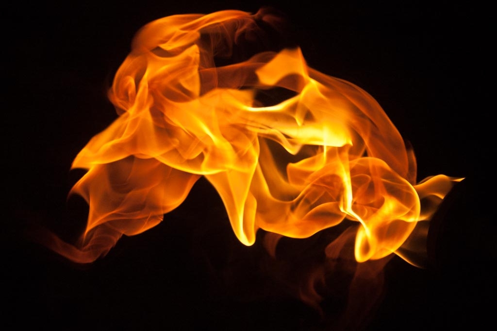 Fire and flames on a black background photograph. 