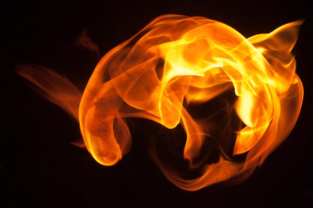 Fire and flames on a black background photograph. 