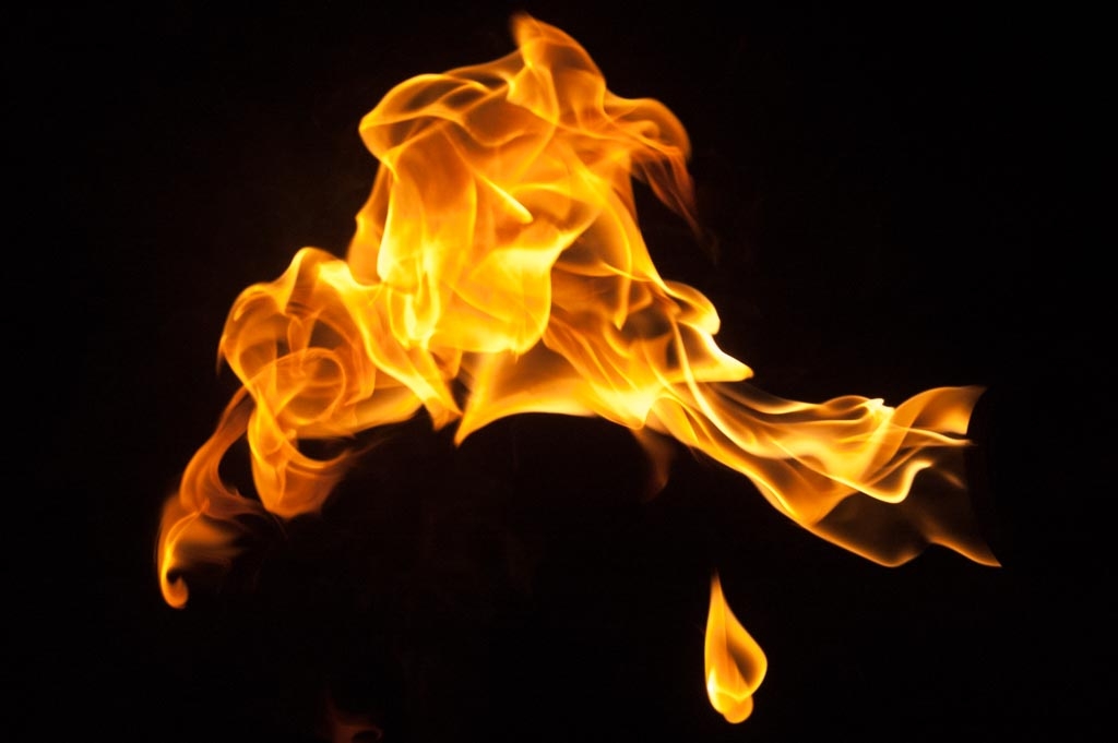 Fire and flames on a black background photograph. 