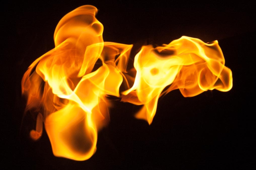 Fire and flames on a black background photograph. 
