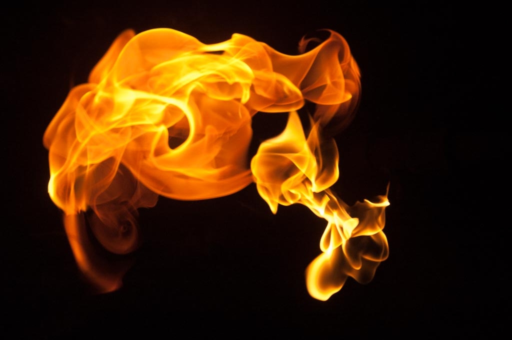 Fire and flames on a black background photograph. 