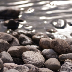 Big Sur pebbles and ripples in the water