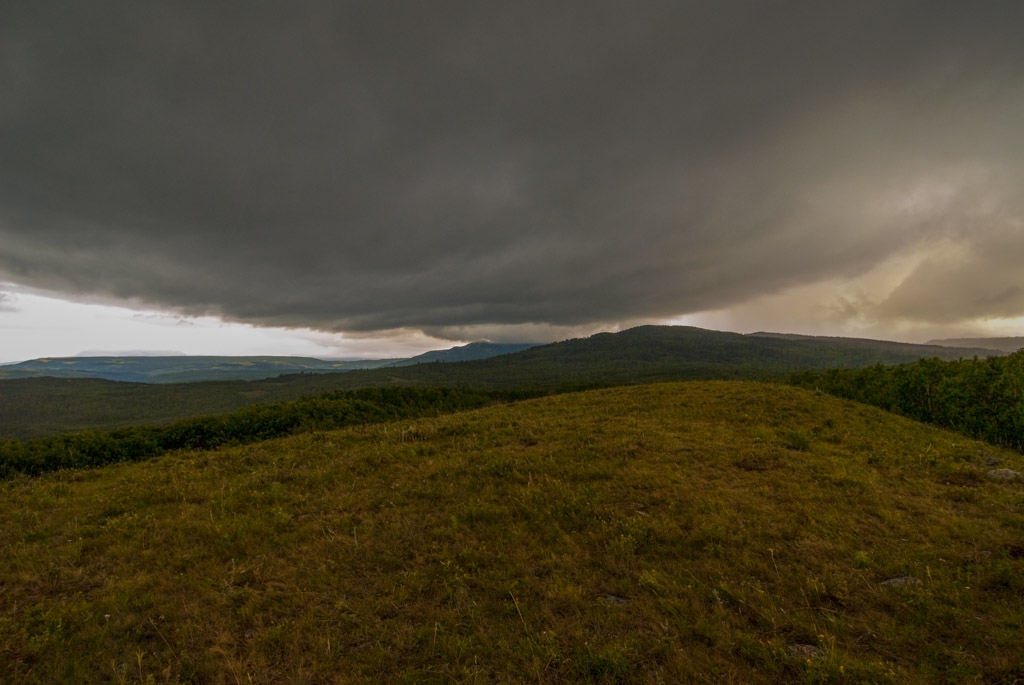 Glacier National Park, Montana photograph. This was the sky right before it let out a huge CRACK of lightning and thunder next to our jeep. I was outside of the park property and on Blackfeet Indian reservation land, on a guided tour looking for animals/nature. I didn't see any animals but we did see bearprints and other features of the landscape, and a giant rainbow.