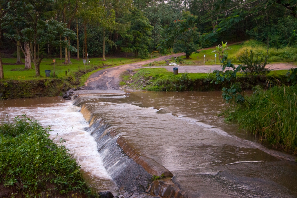 Kauai, Hawaii photograph. We were driving to the top of the island to see one of the world's rainiest spots (Mt Waialeale, Kauai, Hawaii), but of course the roads were washed out before we could get there! We saw cards drive across this bit but we had but a lowly rental car and didn't want to risk it.